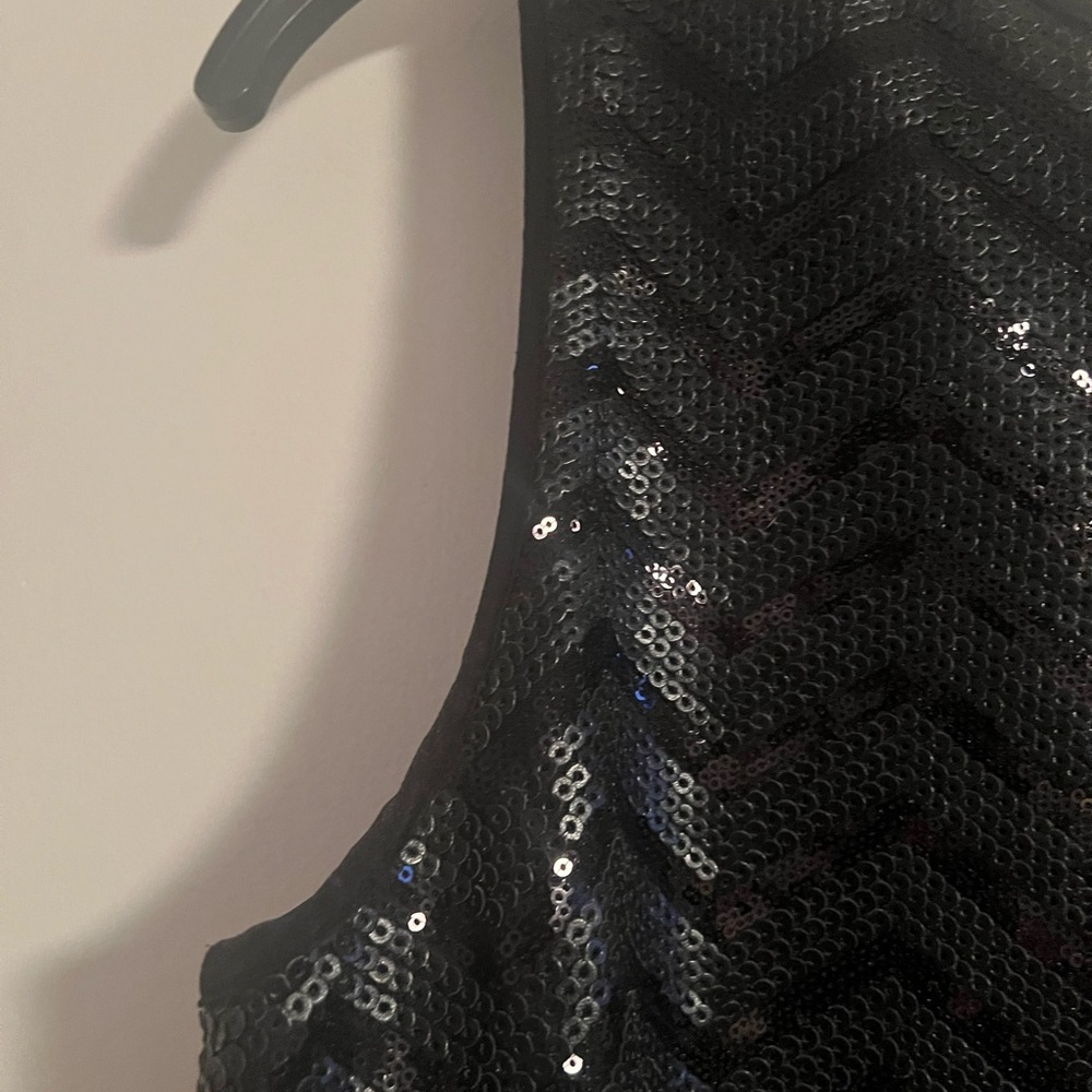 Black sequins bebe size Medium. Signature piece, can be dressed up or down.